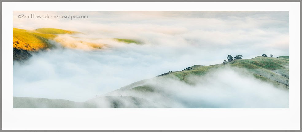 Rolling mist over hills of Banks Peninsula at sunset, Canterbury, New Zealand